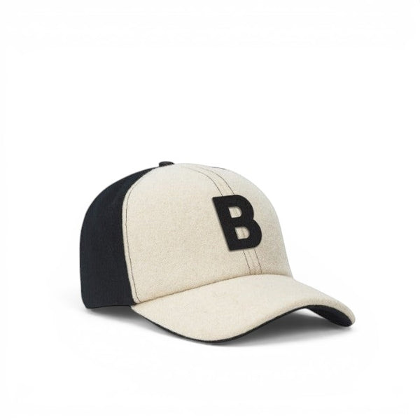 Baabuk Blacknose baseball cap in cream and black wool with an embroidered letter B and adjustable leather strap.