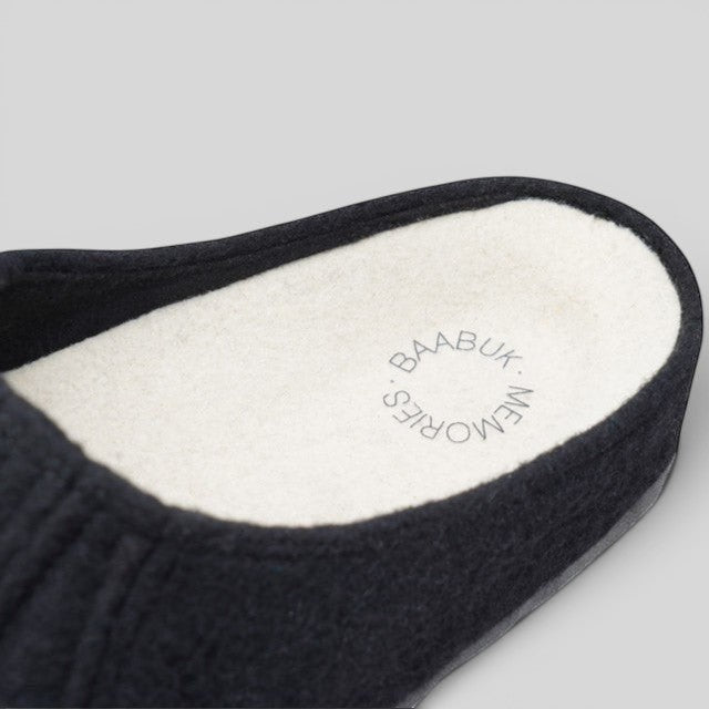 Baabuk Alpina black wool slipper sandal featuring a white insole with a branded Baabuk Memories logo detail.