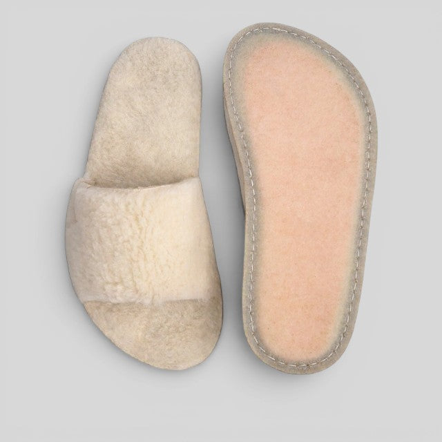 Baabuk Baabulette Fluffy wool slide sandals in cream with natural crepe rubber soles, handmade in Nepal.