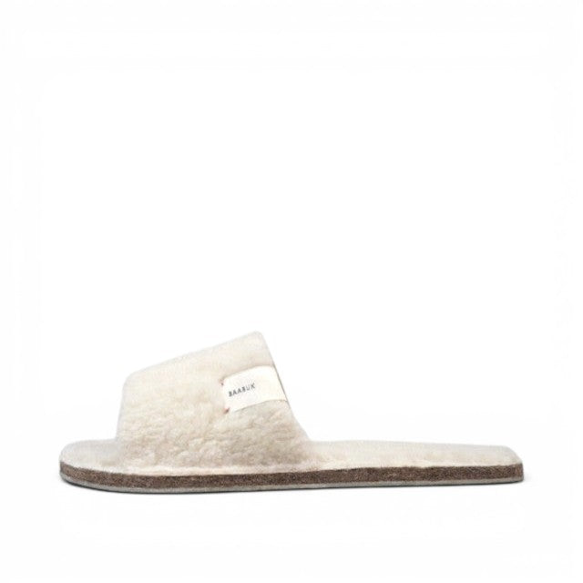 Baabuk Baabulette Fluffy wool slide sandals in cream with a natural crepe rubber sole and side brand label.