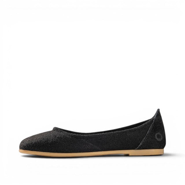 Baabuk black wool ballerina flat with a durable rubber sole, side view of minimalist slip-on shoe.
