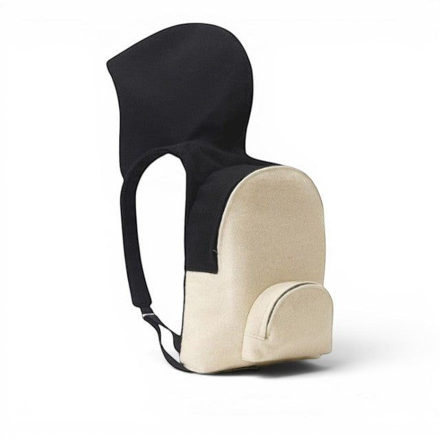 Baabuk Blacknose hooded backpack in beige and black wool with adjustable straps and a small front compartment.