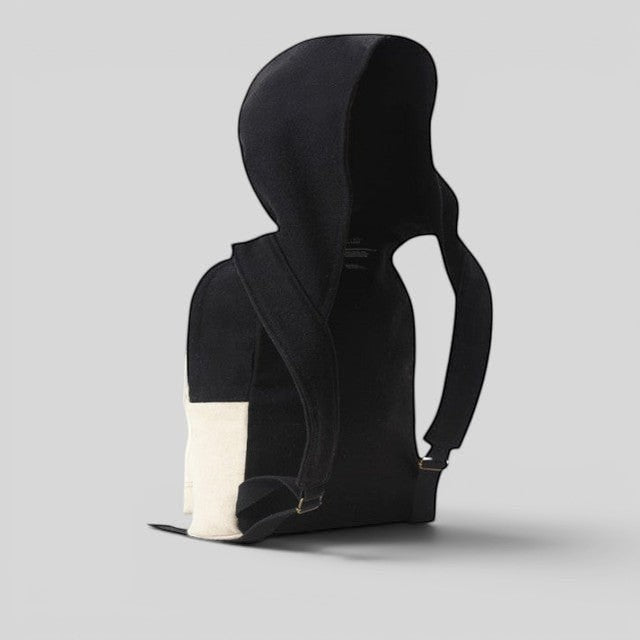 Baabuk Blacknose hooded backpack in black and cream wool with adjustable shoulder straps and outer compartment.