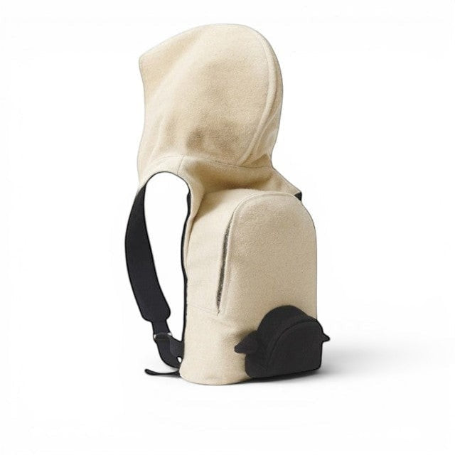 Baabuk Blacknose hooded backpack in cream wool with a black outer compartment and adjustable straps