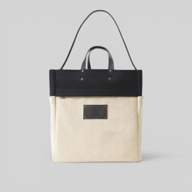 Baabuk BBB Bag Blacknose tote made of cream and black burel wool with leather handles and shoulder strap.