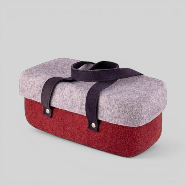 Baabuk Bordeaux wool beer cooler with a grey lid, red base, and dark leather carrying straps.