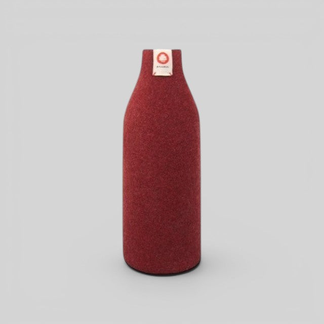 Baabuk bordeaux wool bottle cover with natural insulation and a small branded tag on a light grey background.