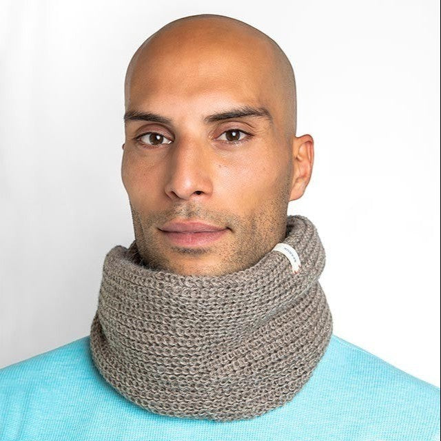 Baabuk brown baby alpaca wool infinity scarf worn by a man against a white background