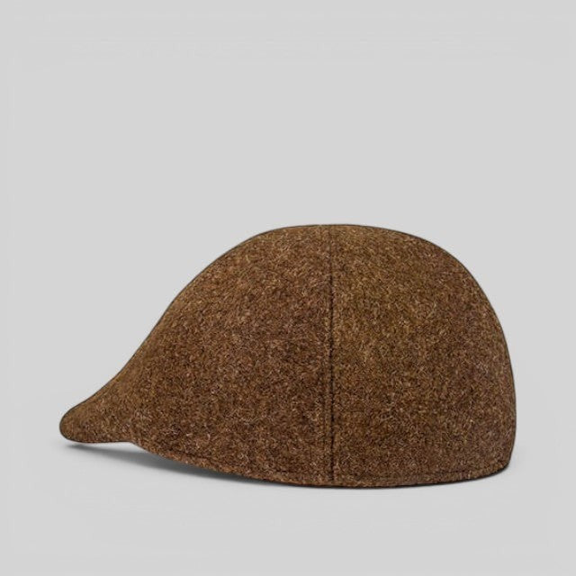Baabuk brown wool beret inspired by traditional Portuguese shepherd hats, featuring a textured natural finish.