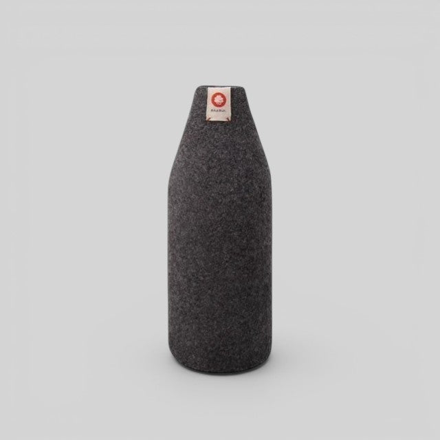 Baabuk dark grey wool bottle cover with natural insulation and a small branded tag on a light grey background.