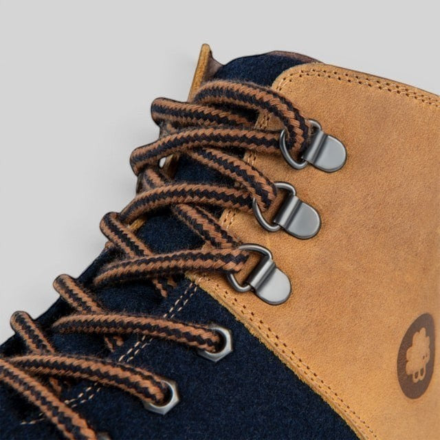 Baabuk Ice Wooler navy and brown wool hiking boot detail featuring nubuck leather, metal eyelets, and striped laces.