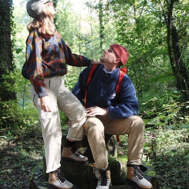 Baabuk Ice Wooler pepper brown wool boots worn by a couple in a forest setting