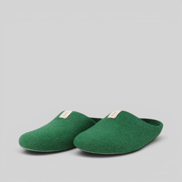 Baabuk Kanga lush green wool slippers with a slip-on design and minimalist aesthetic.
