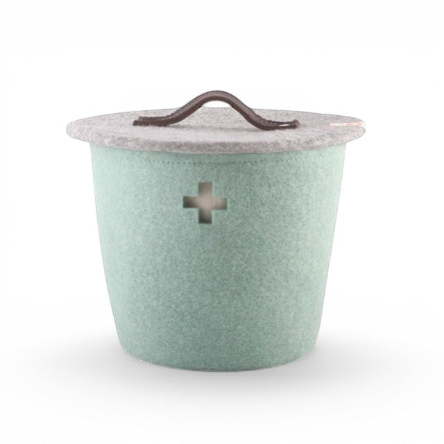 Baabuk small light blue felted wool basket with a Swiss cross cutout and a brown leather handle lid.
