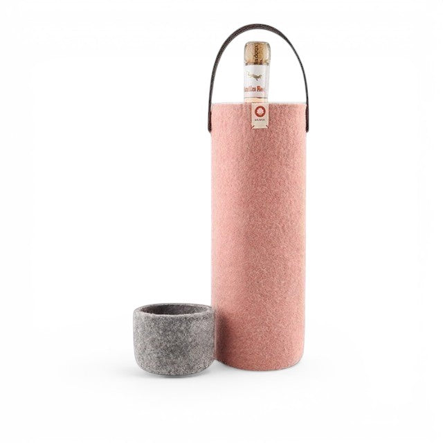 Baabuk pink wool wine cooler with a leather strap and a matching grey wool base, holding a wine bottle.