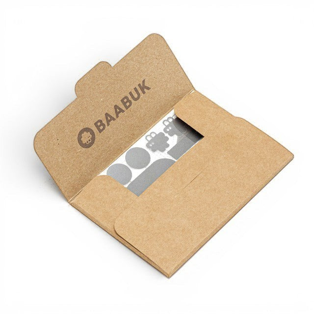 Baabuk repair kit featuring grey adhesive patches inside a branded brown recycled paper envelope