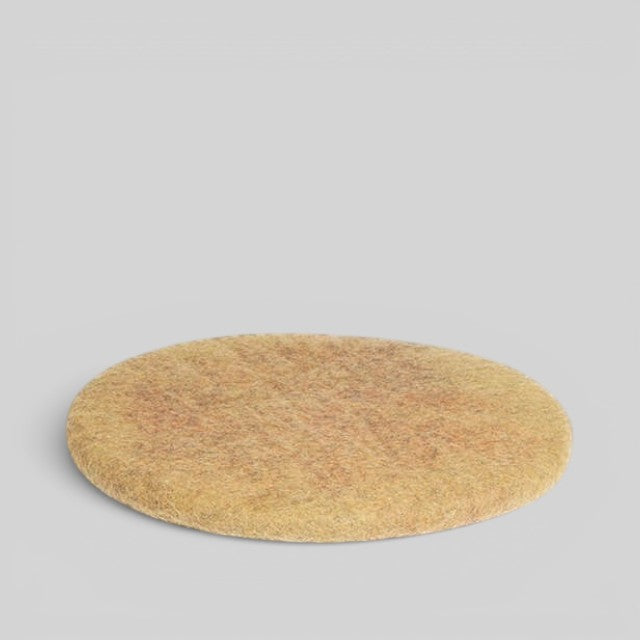 Baabuk handmade round sitting mat made from natural New Zealand wool in a warm tan colour