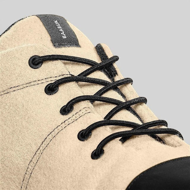 Baabuk Sky Wooler Blacknose sneaker in beige wool with black elastic laces and a black nubuck toe cap detail.