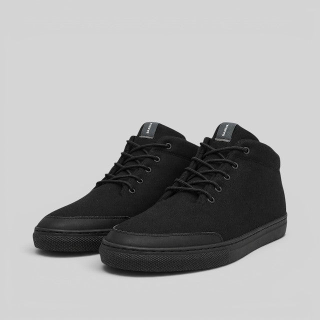 Baabuk Sky Wooler monochrome black sneakers featuring a natural wool upper, nubuck detailing, and durable rubber soles.