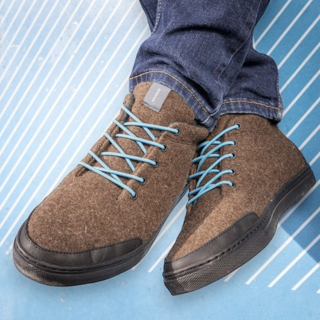 Baabuk Sky Wooler sneakers in brown Roux du Valais wool with blue laces and black rubber soles worn with jeans.