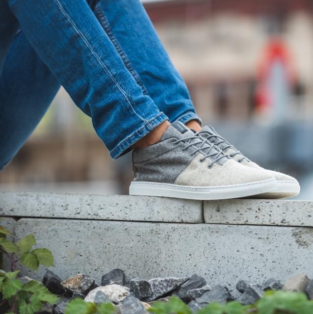Baabuk Sky Wooler sneakers in middle grey wool with rubber soles worn with blue jeans outdoors
