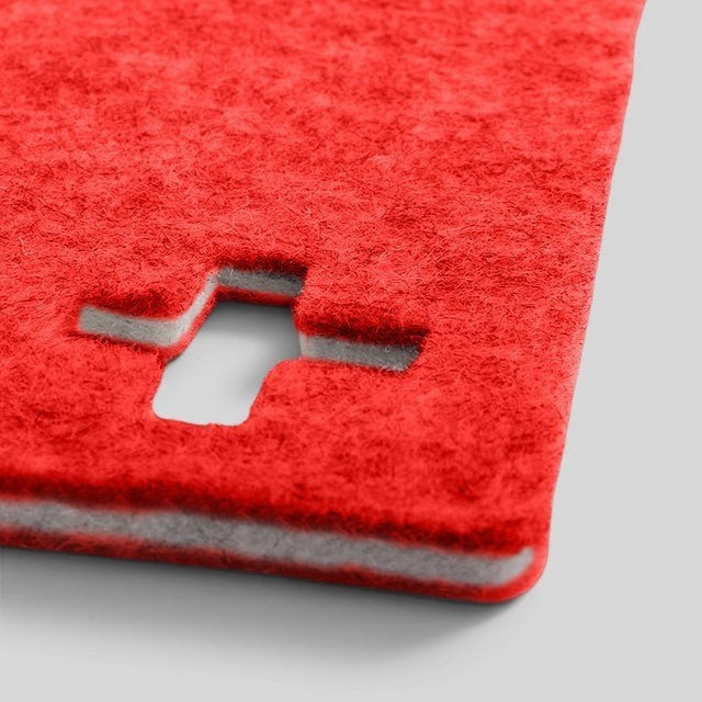 Baabuk Swiss red felted wool table mat with a cutout Swiss cross detail, handmade from natural New Zealand wool.