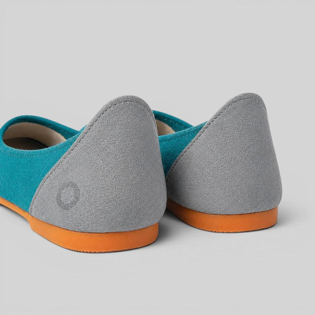 Baabuk teal wool ballerina flats with grey nubuck heel detail and orange rubber soles, rear view.