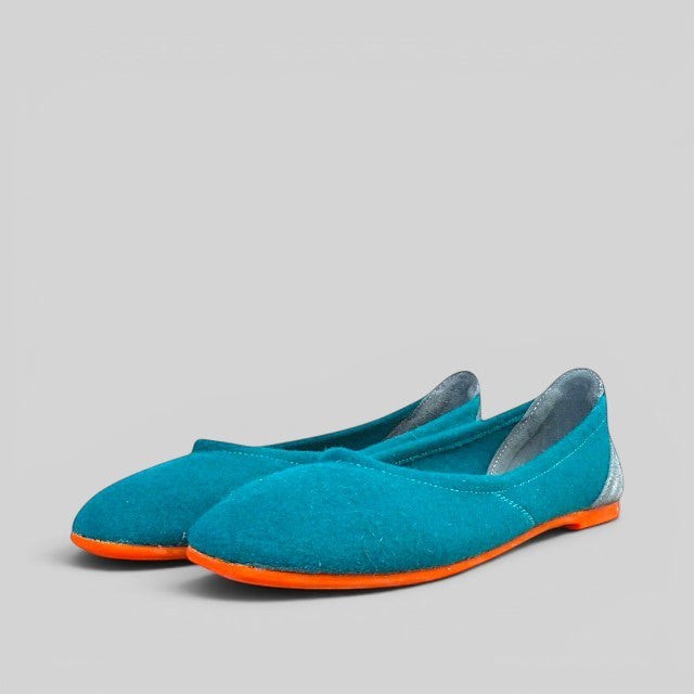 Baabuk teal wool ballerina flats with a vibrant orange rubber sole and grey nubuck heel detail.