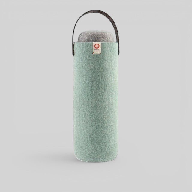 Baabuk turquoise wool wine cooler with a brown leather strap for portable, eco-friendly bottle insulation.