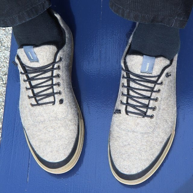 Baabuk Urban Wooler sneakers in grey recycled wool with black trim, elastic laces, and durable rubber soles.