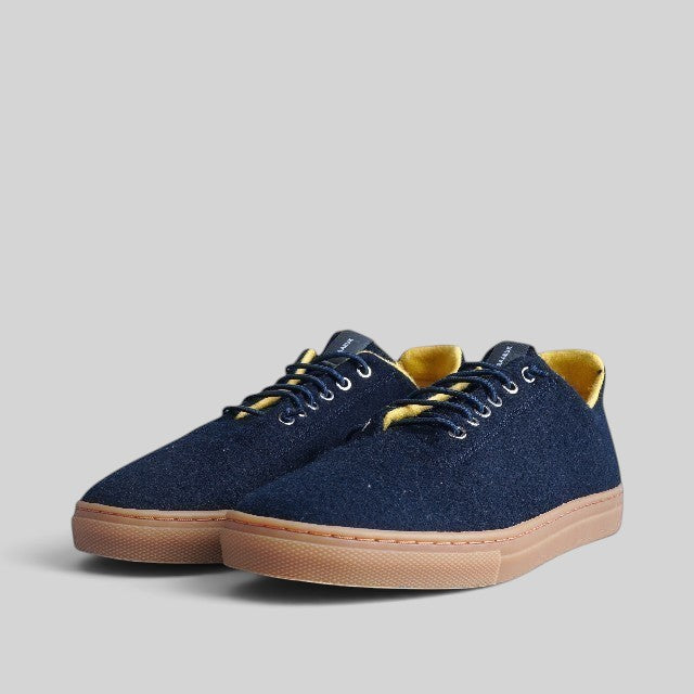 Baabuk Urban Wooler sneakers in navy wool with bright yellow lining and gum rubber soles.
