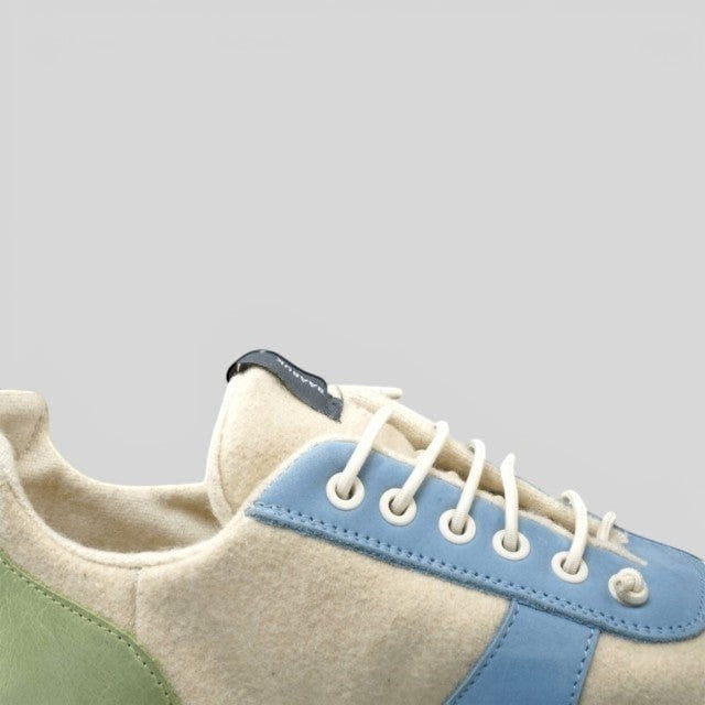 Baabuk Urban Wooler Wonderland sneakers featuring cream wool, light blue nubuck trim, and green suede heel detail.