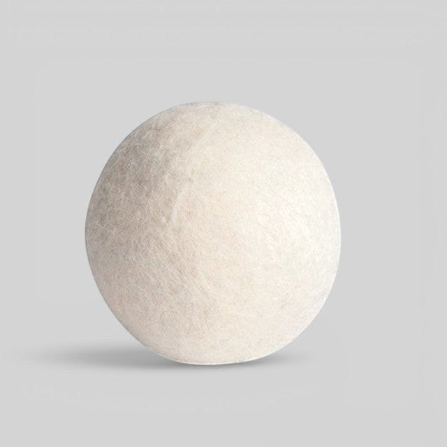 Baabuk handcrafted white wool dryer ball for sustainable, chemical-free laundry softening and faster drying.
