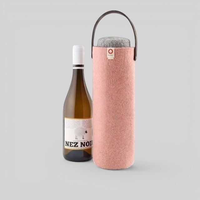 Baabuk pink wool wine cooler with a brown leather strap, keeping a wine bottle chilled for outdoor picnics.