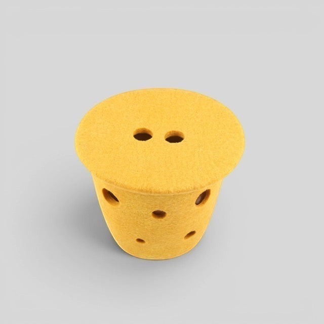 Baabuk small felted wool basket in yellow with Swiss cheese inspired holes and a flat top